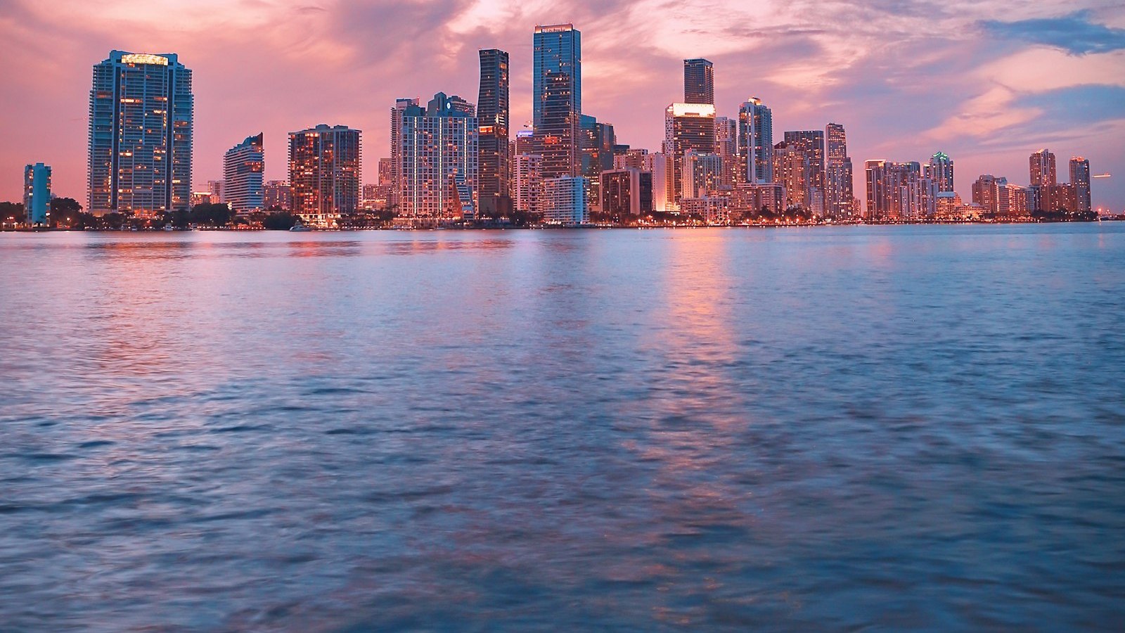 The Miami skyline at sunset across Biscayne Bay